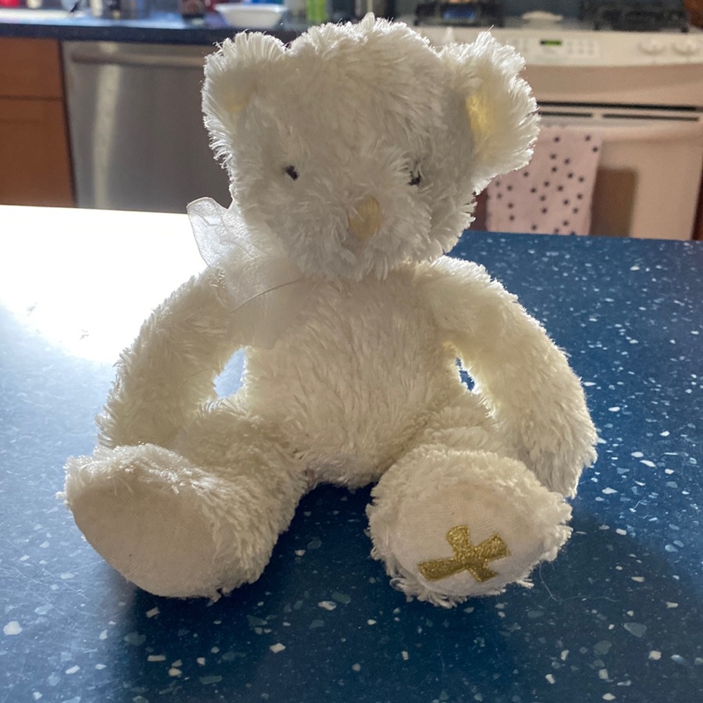 Stuffed bear/cross on paw
